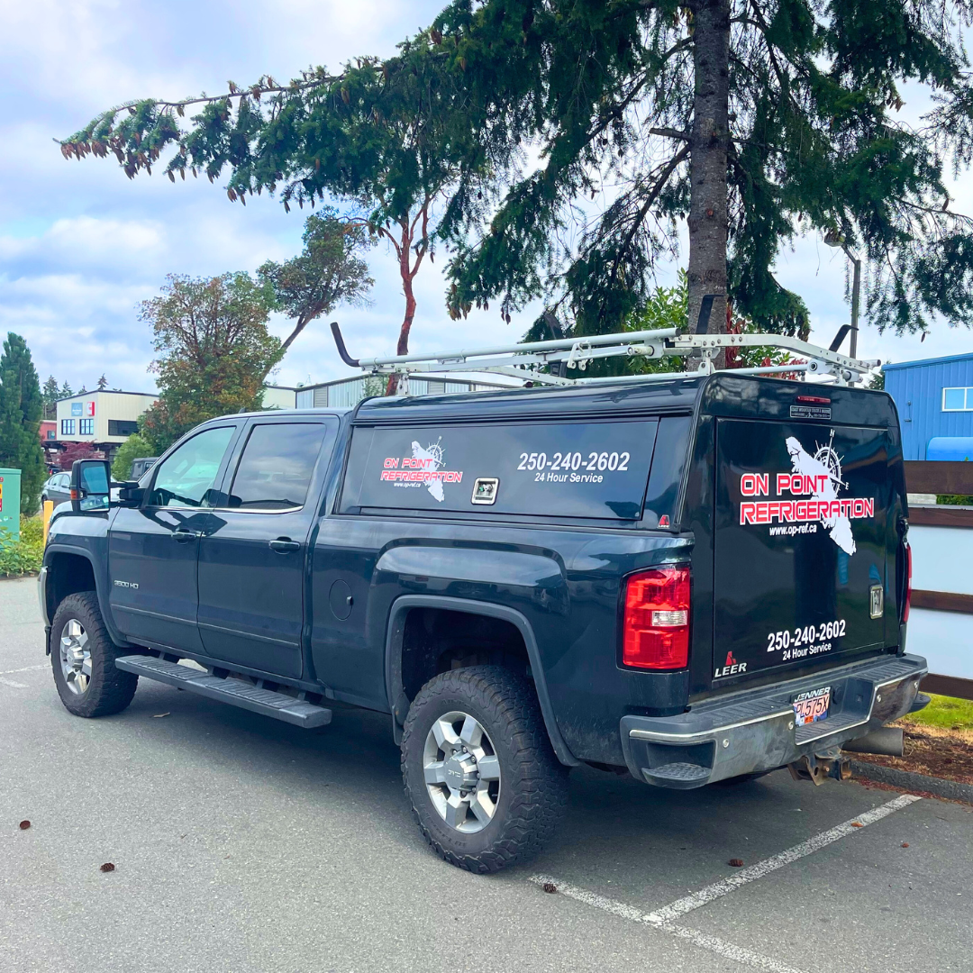 On Point Refrigeration service van with company logo, 250-240-2602 and 24 Hour Service on the side, parked on Vancouver Island
